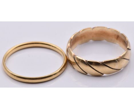 A 9ct gold ring/ band (2.6g, size K) and an 18ct gold wedding band (1.3g, size K)