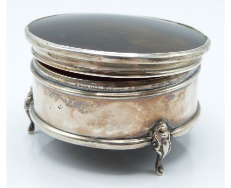 George V hallmarked silver tortoiseshell lidded dressing table trinket pot with padded interior, raised on three feet, Birmin