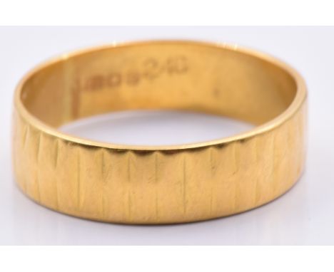 A 22ct gold textured wedding band/ ring, 4.2g, size O/P&nbsp;