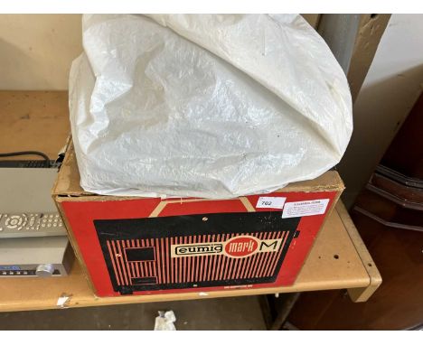 A vintage projector screen and tapes
