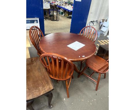Circular kitchen table and four stick back chairs
