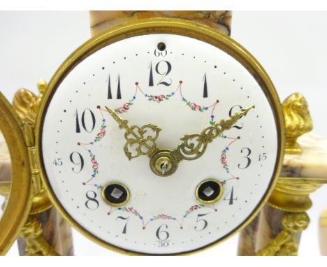 Early 20th century gilt metal and pink marble portico clock garniture, urn shaped pediment above circular Arabic dial, floral