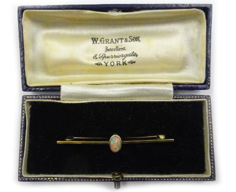 Opal set gold bar brooch, stamped 15 Condition Report & Further Details Approx 2.2gm, length =5cmClick here for further image