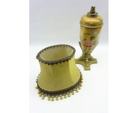 20th century porcelain table lamp of ovoid form hand painted with Chrysanthemums, supported by a painted brass base with shad