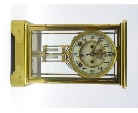 Early 20th century brass four glass mantel clock, enamel Arabic chapter ring with visible escapement, twin train 'Ansonia' mo