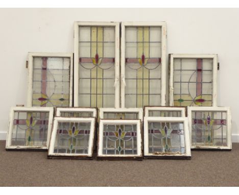 Collection of lead glazed stained glass windows with stylised floral design, two large portrait (46cm x 128cm), two large lan