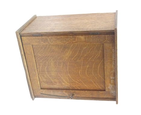 Early 20th century oak table top smokers cabinet with panelled door and fitted interior pigeonhole and tobacco jar shelf, hav