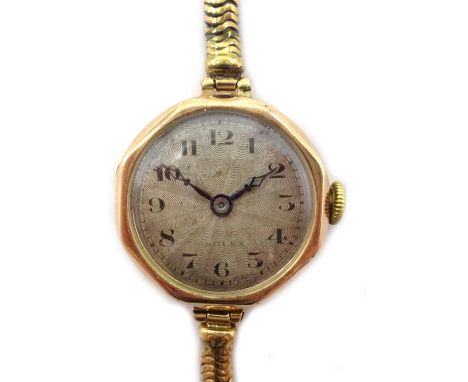 Rolex 9ct gold ladies wristwatch, engine turned dial, hallmarked, on gold snake chain strap stamped 9ct Condition Report & Fu