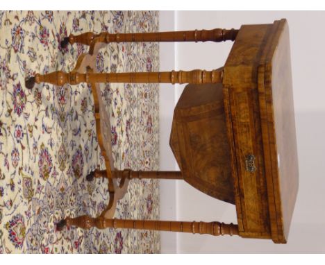 Victorian figured walnut and amboyna banded games table, fold-over canted rectangular top with inlaid chess and backgammon bo