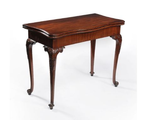 A George III mahogany concertina action folding card table, circa 1760, attributed to Paul Saunders, the hinged serpentine sh