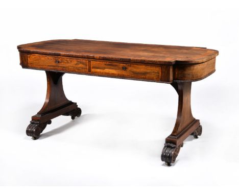 ϒA Regency rosewood and satinwood crossbanded library table, circa 1815, in the manner of Gillows, the top with D-shaped ends