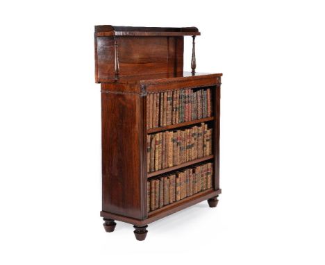 ϒA George IV rosewood open bookcase, circa 1825, the raised shelf with three quarter gallery, the rectangular top above the f