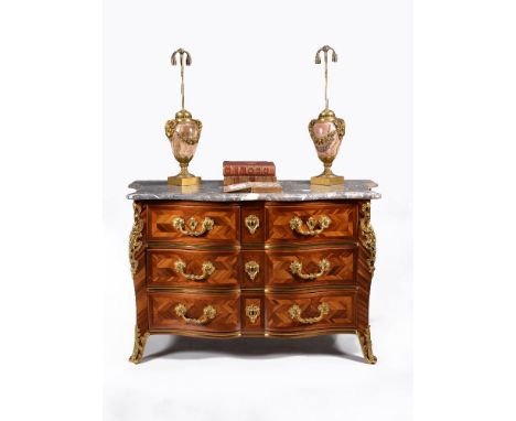 A Regence parquetry, tulipwood and ormolu mounted serpentine commode, circa 1720, the shaped marble top with moulded edge, ab