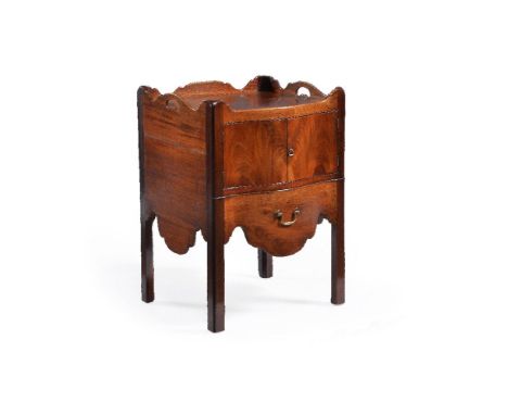 A George III mahogany serpentine fronted night commode, circa 1770, the top with shaped gallery and pierced side carrying han
