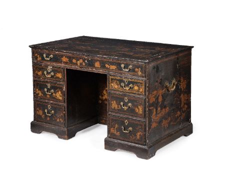 A Chinese Export black and gilt lacquer kneehole desk, circa 1770, decorated with traditional Chinese village and landscape s