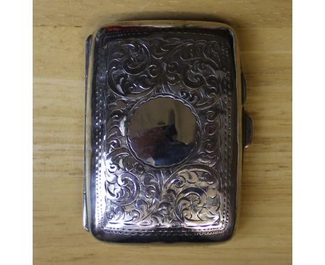 A George V silver cigarette case, with engraved curved body, 8cm x 5cm, Birmingham 1914, weight 42g