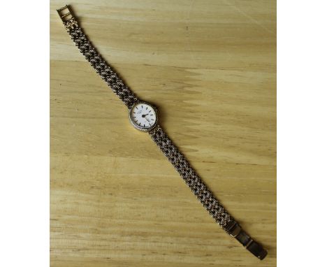 A ladies 9ct gold Rotary wristwatch and bracelet 1.5cm, marked 375, 13grams Scratches and chip to glass.