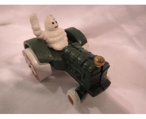 Michelin man on tractor, H 70 mm. P&amp;P Group 1 (£14+VAT for the first lot and £1+VAT for subsequent lots) 
