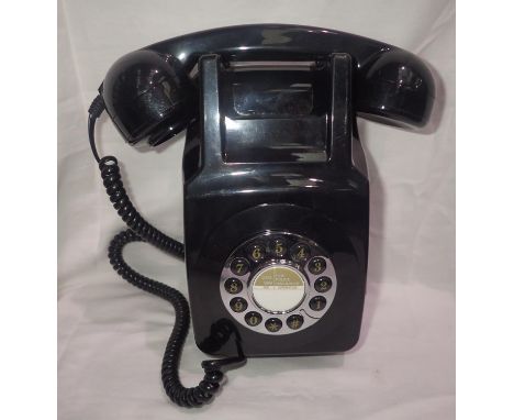 Black rotary style wall telephone. P&amp;P Group 1 (£14+VAT for the first lot and £1+VAT for subsequent lots) 