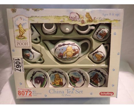 Boxed Schylling Winnie The Pooh china tea set. P&amp;P Group 2 (£18+VAT for the first lot and £3+VAT for subsequent lots) 