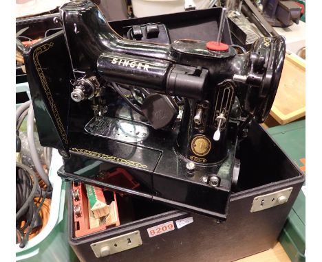 Singer Featherweight model 221 portable electric sewing machine with embroidery loop and other parts. All electrical items in