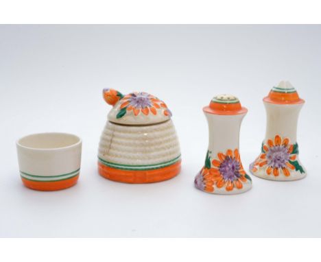 Clarice Cliff for Newport Pottery, on orange 'Marguerite' cruet set and miniature beehive honey pot