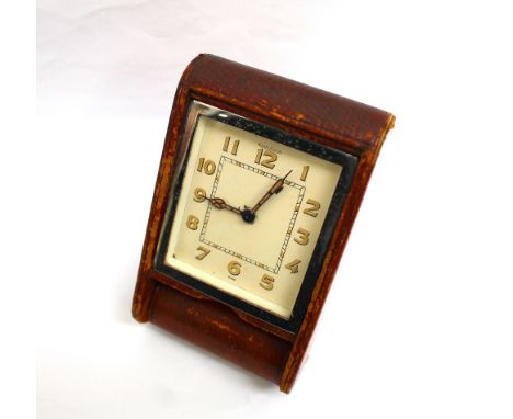 An Art Deco Jaeger Le Coultre travel alarm clock, the three inch rectangular chrome framed face within a French leather case 