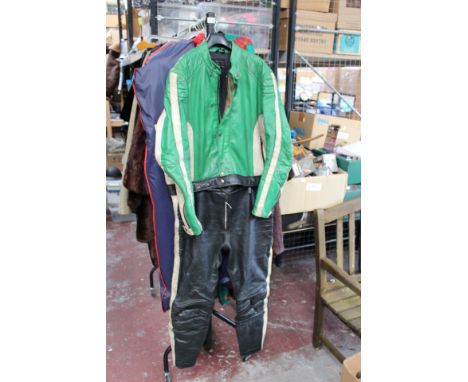 A Motorbike jacket and trousers, jacket in white leather with green leather shoulders, and panel 'Norton' trousers are black 