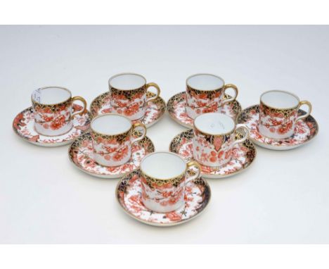 A Royal Crown Derby set of six coffee cans and saucers, early 20th Century, hand painted in the 2649 pattern, together with a