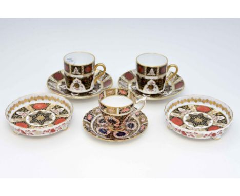 A collection of Imari ceramics, comprising an early 20th Century Royal Crown Derby 1128 Imari pattern coffee cup and saucer, 