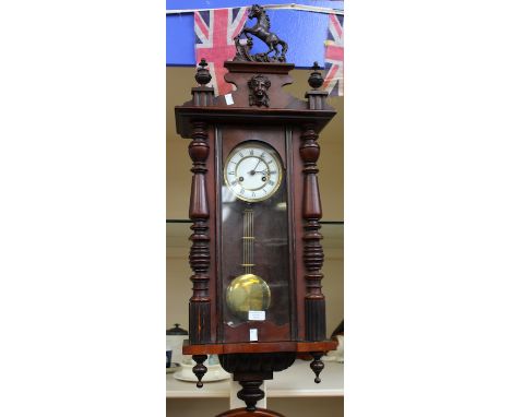 A Victorian carved mahogany Vienna wall clock, 8-day movement, white enamel dial, Roman numerals