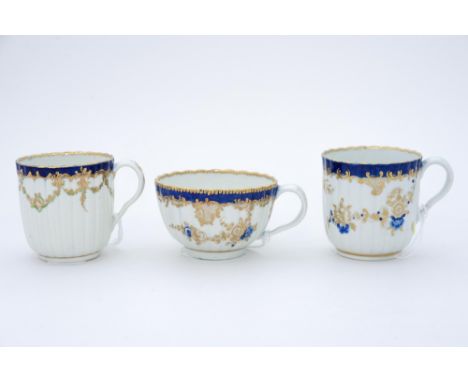 Three Worcester fluted cups, a coffee cup painted with an urn within blue & gilt borders (ex Zorensky Collection) and a blue 