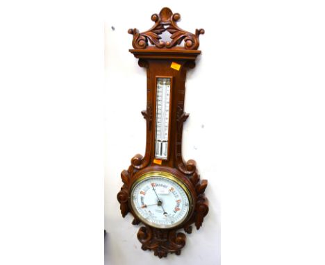 A modern oak banjo barometer, carved finial