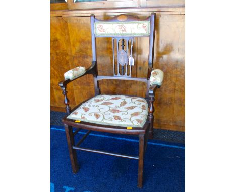 An Edwardian mahogany child's chair, inlaid, with a padded back panel, padded arms and padded seat