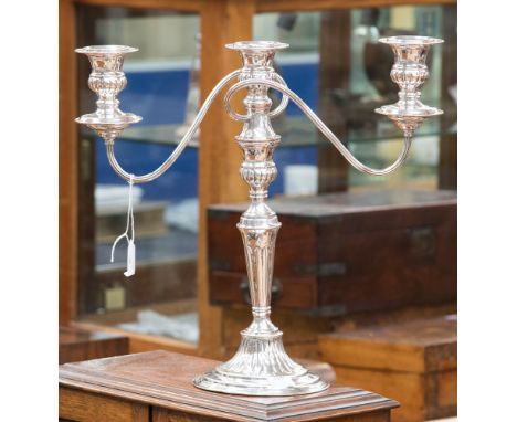 A Mappin and Webb Mappin plate twin branch, three light candelabrum with detachable sconces fitted on a central fluted stem, 