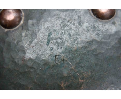 A Hugh Wallace hand hammered circular copper bowl on four button feet, rope twist decoration to rim, diameter 33 cm 