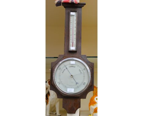 An Art Deco oak cased barometer and thermometer, by W. Evans & Son, Matlock