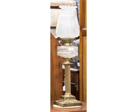 A 19th Century brass oil lamp, with a frosted glass shade, fitted with an adjustable wick, turned column, cut glass resevoir