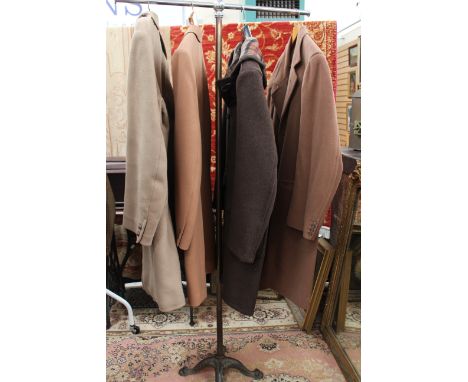 A dark brown  wool duffle coat with plaid lining, 1960s, together with a gentlemen's wool camel coat with stitching around th