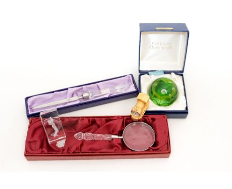 A boxed Caithness paperweight, a Royal Brierley Crystal magnifying glass, an Edinburgh Crystal letter opener, a mini train cl