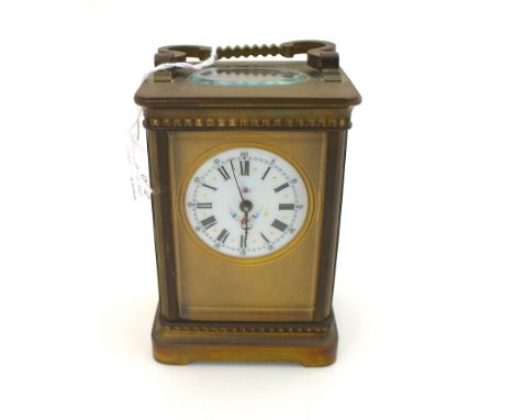 A French brass carriage timepiece, circa 1890, corniche case, 5 cm circular enamel dial with Roman numerals, visible escapeme