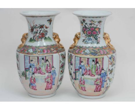 A pair of Famille Rose vases standing approx 37 cms high, both drilled to the base to facilitate electric cable for lamp adap