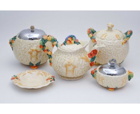 Clarice Cliff for Newport Pottery, 'Celtic Harvest' teapot, biscuit barrels, preserve pot and dish (5)