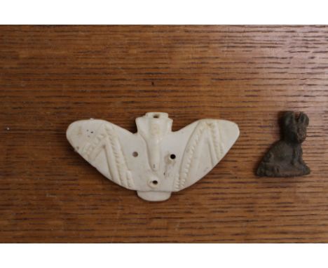 Two ethnographic amulets to include a bone moth and stone cat type animal, possibly Egyptian or Roman (2)