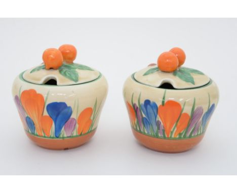 Clarice Cliff for Newport Pottery, two 'Crocus' preserve pots, ogee form (2)