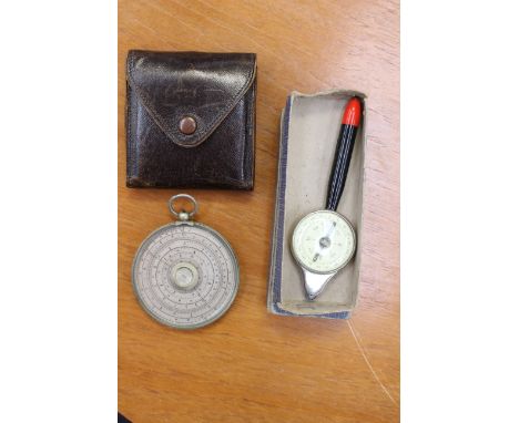 A map measurer and compass, with a Halden Calculux slide rule, (2)