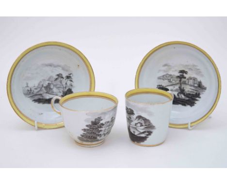  A Chamberlain Worcester tea cup and saucer and coffe cup and saucer, En Grisaille printed within yellow and gilt borders, ci