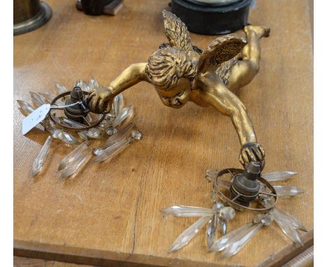 An Italian style gilt Geso putti ceiling light with hanging lustres in each hand  