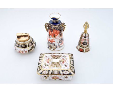 A collection of Royal Crown Derby comprising a 2451 Imari pattern trinket dish, a 2451 pattern table lighter, a 1128 pattern 