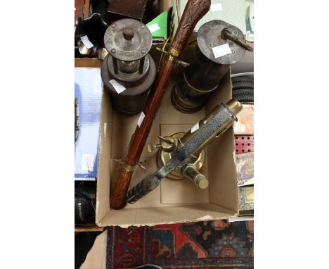 Two early miners' lamps, to include the 'CEAG' lamp Barnsley South Yorks, a brass blow lamp and an Indian 20th Century carvin